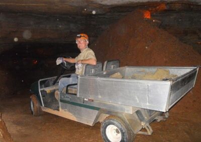 Employee on cart in the cavern