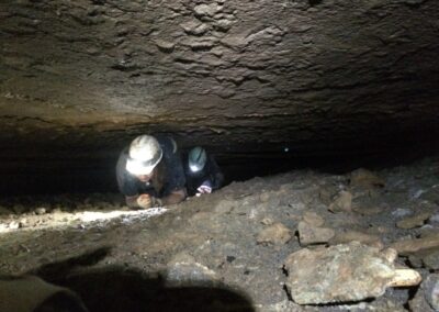 Guests crawling through cavern during Wild Tour